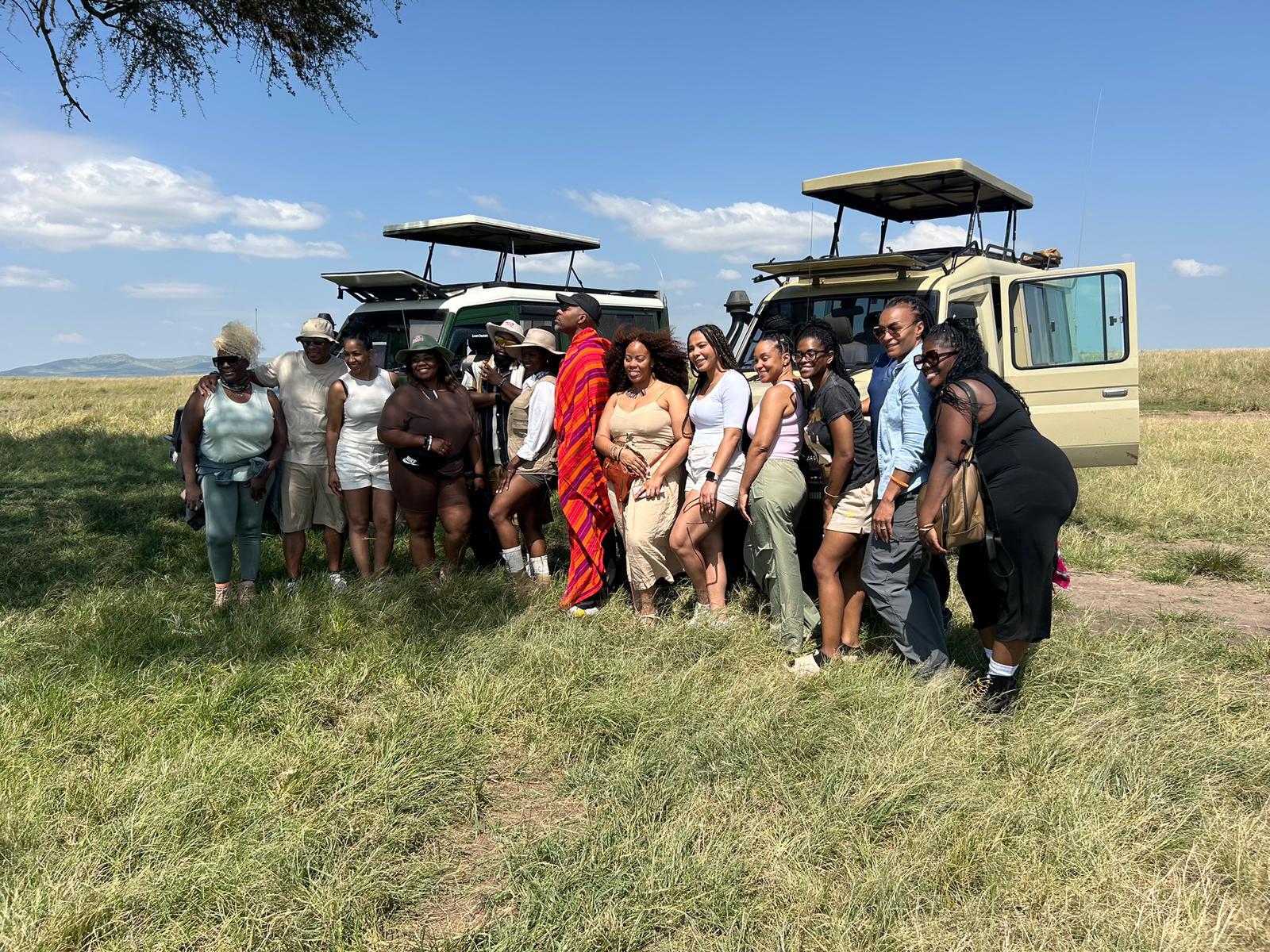 Safari Nomads guests and guides beside private safari vehicles